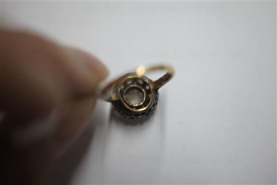 An early 20th century 18ct gold and diamond cluster ring, size K.